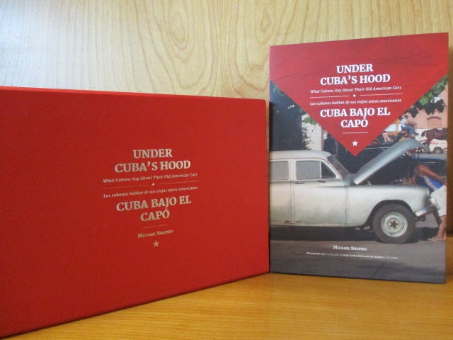 Item #187023 UNDER CUBA'S HOOD : WHAT CUBANS SAY ABOUT THEIR OLD AMERICAN CARS = CUBA BAJO EL CAPÓ : LOS CUBANOS HABLAN DE SUS VIEJOS AUTO AMERICANOS. Michael Shapiro.